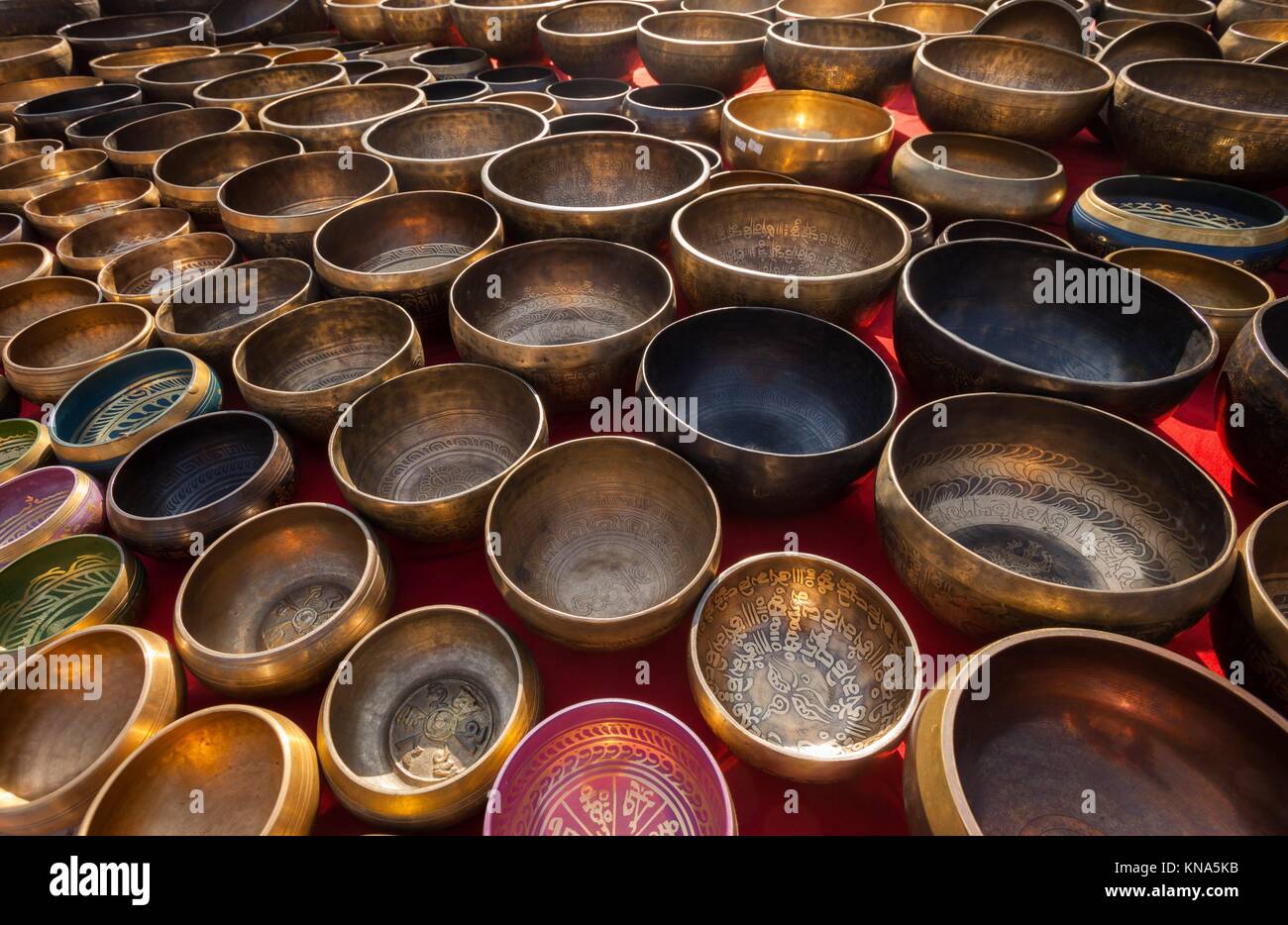 Traditional singing bowls on display at a market in Nepal Stock Photo