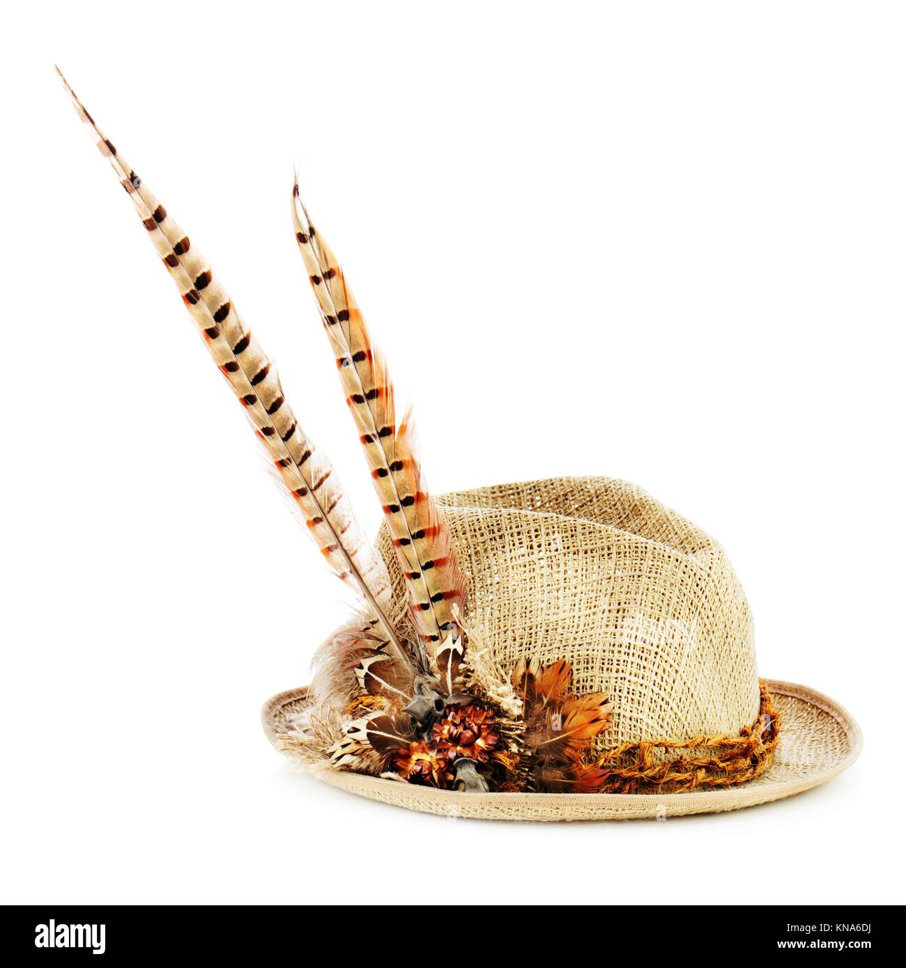 Hunting hat with pheasant feathers isolated on white. Closeup Stock