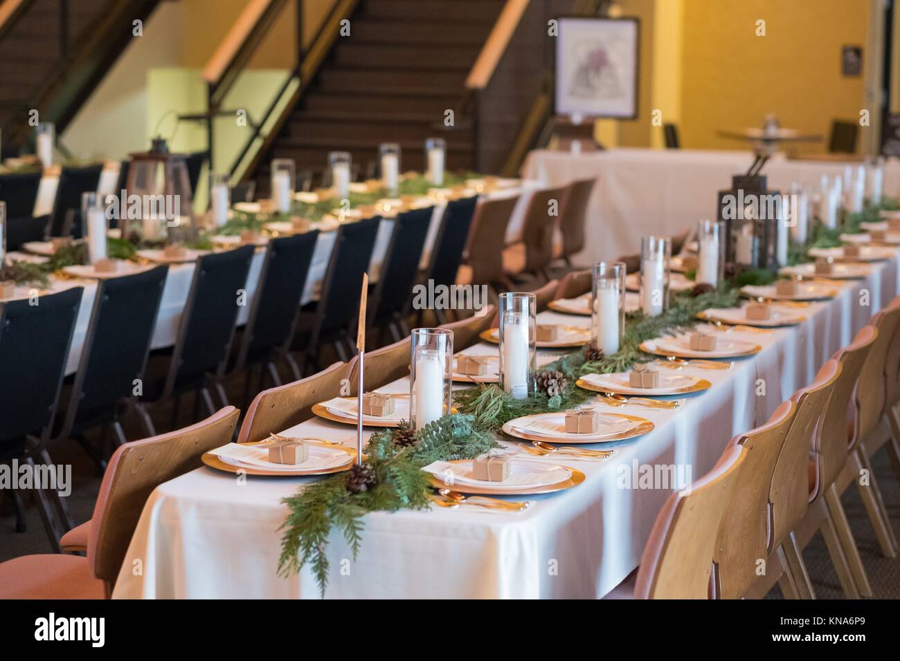 Wedding Reception Tables With Seating Plates And Candles At A