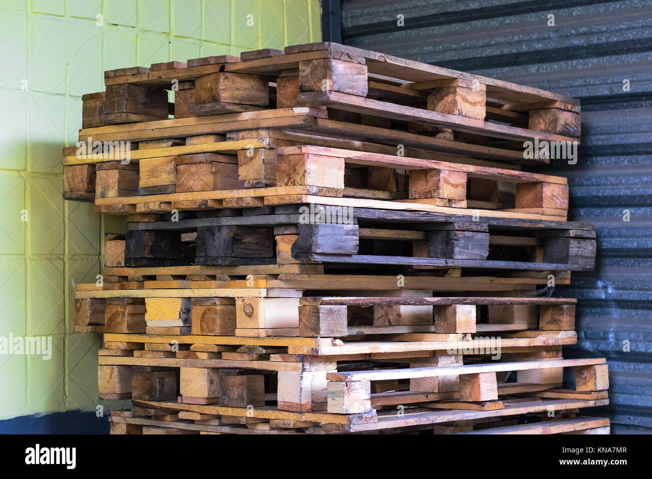 Old wooden pallets in the supermarket warehouse. Texture of pallets Stock Photo