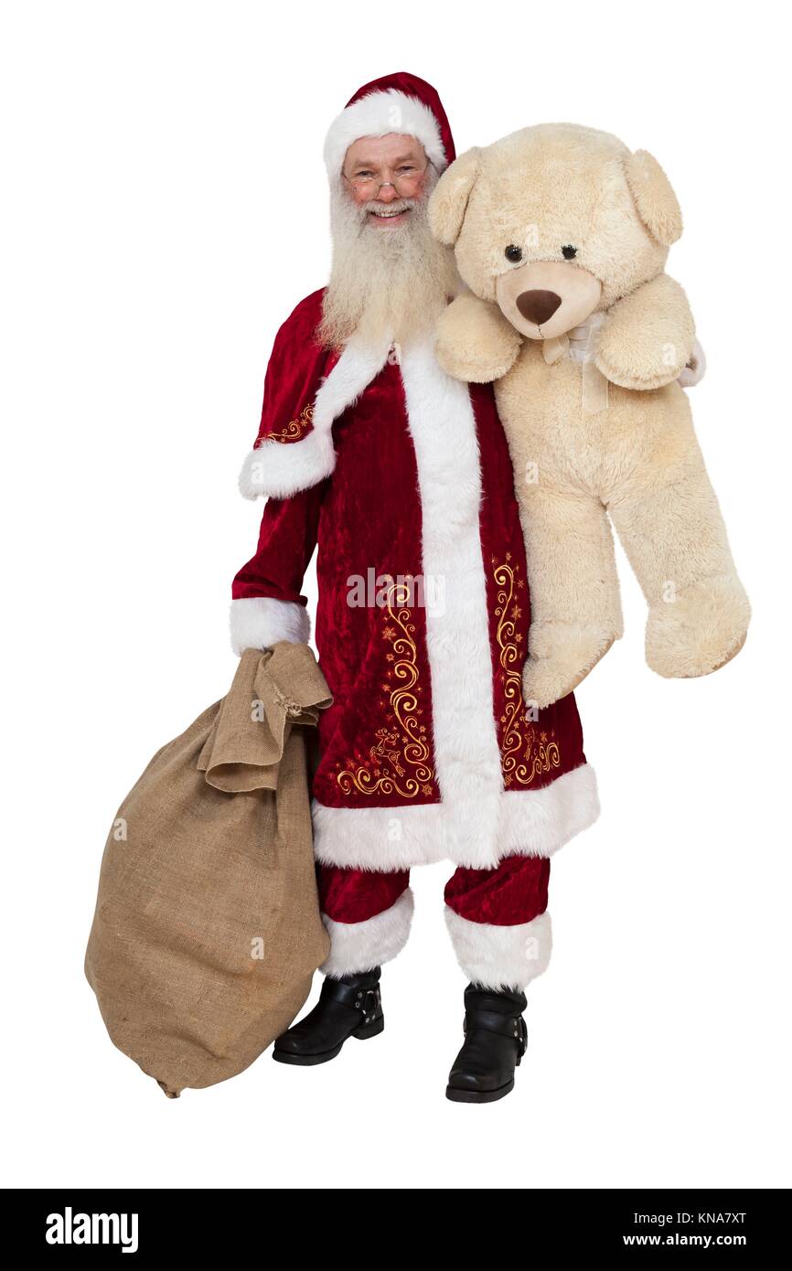 Santa Claus with teddy bear and sack isolated. Stock Photo