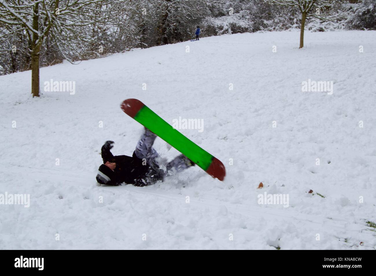 Children and adults enjoying the unexpected heavy snowfall by