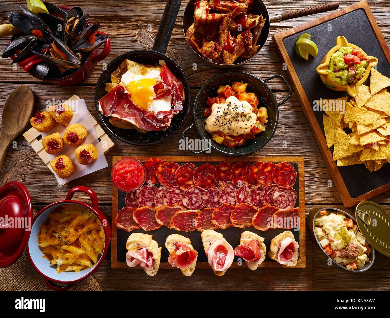 Tapas from Spain varied mix of Mediterranean food recipes. Stock Photo
