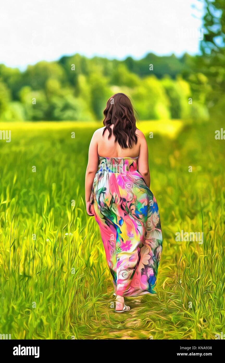 View from back of a woman in a long dress walking the field colorful painting. Stock Photo