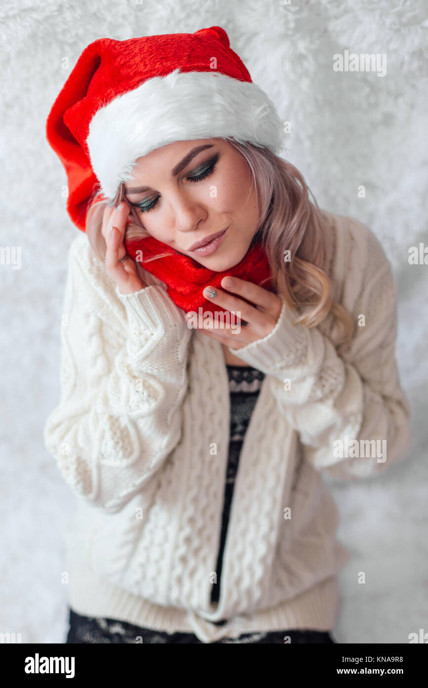 Happy excited young woman in santa claus hat Stock Photo - Alamy