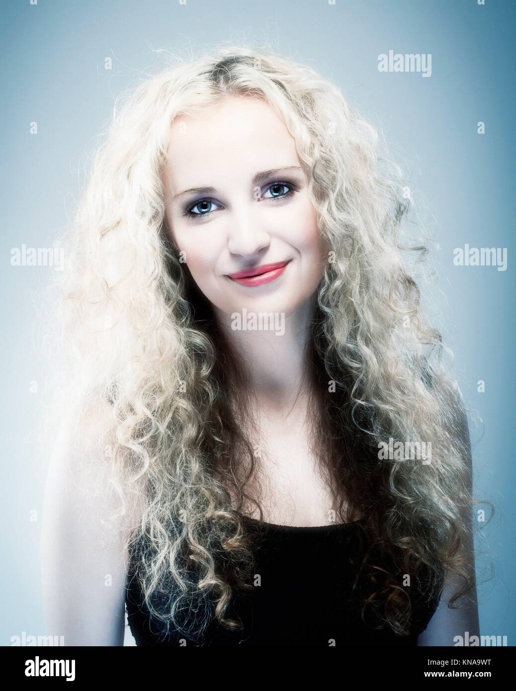 Blond curly hair woman hi-res stock photography and images - Alamy