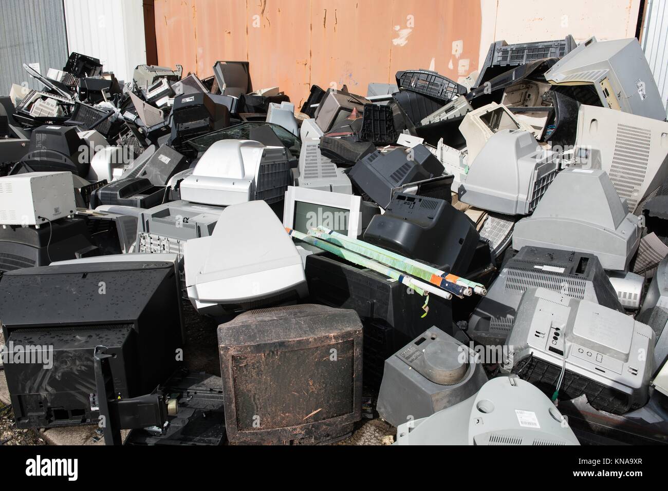 Old used and obsolete electronic equipment before a building Stock