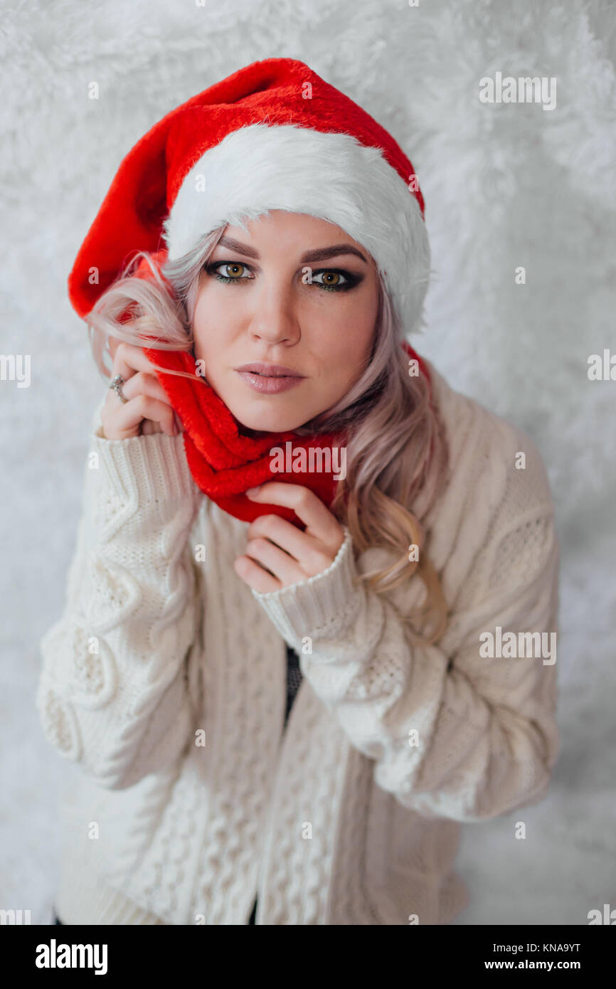 Happy excited young woman in santa claus hat Stock Photo - Alamy