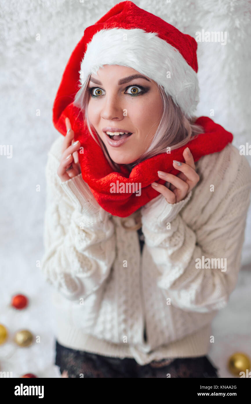 Happy excited young woman in santa claus hat Stock Photo - Alamy