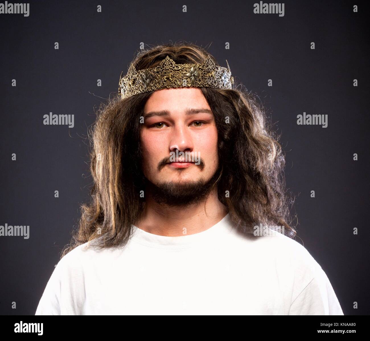 Portrait of a King with Crown and Dark Hair. Stock Photo