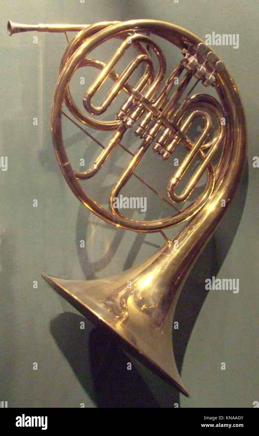 This French horn in F is a brass instrument demonstrating craftsmanship ...