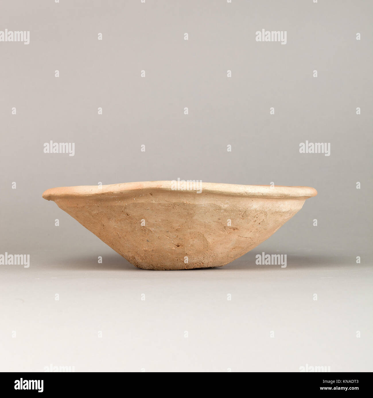This bowl features a flattened rim and represents the craftsmanship of ...