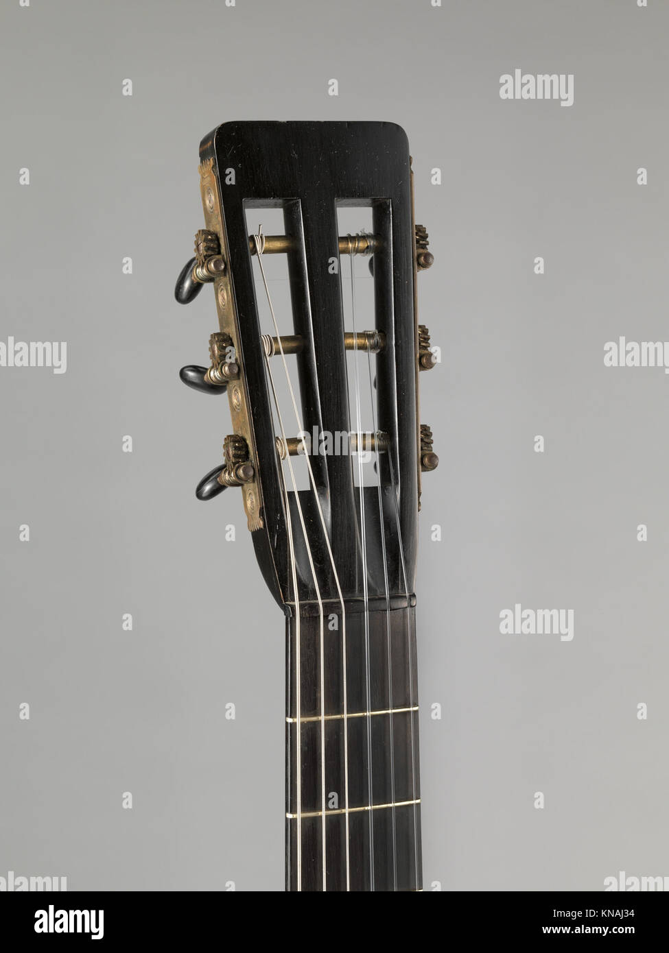 This historical guitar shows design and craftsmanship typical of its ...