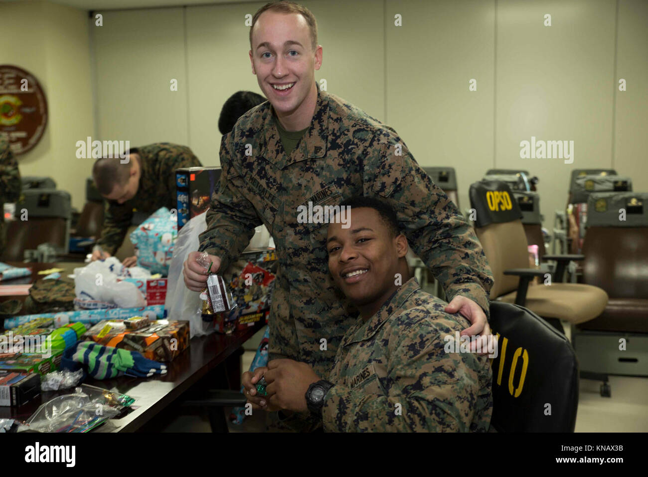 U.S. Marine Corps Cpl. Ethan Metcalfe, left, an aviation supply