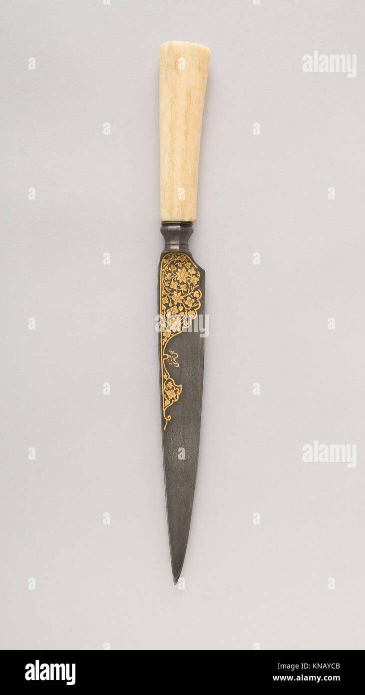 This Kard dagger features a curved blade, exemplifying historical ...