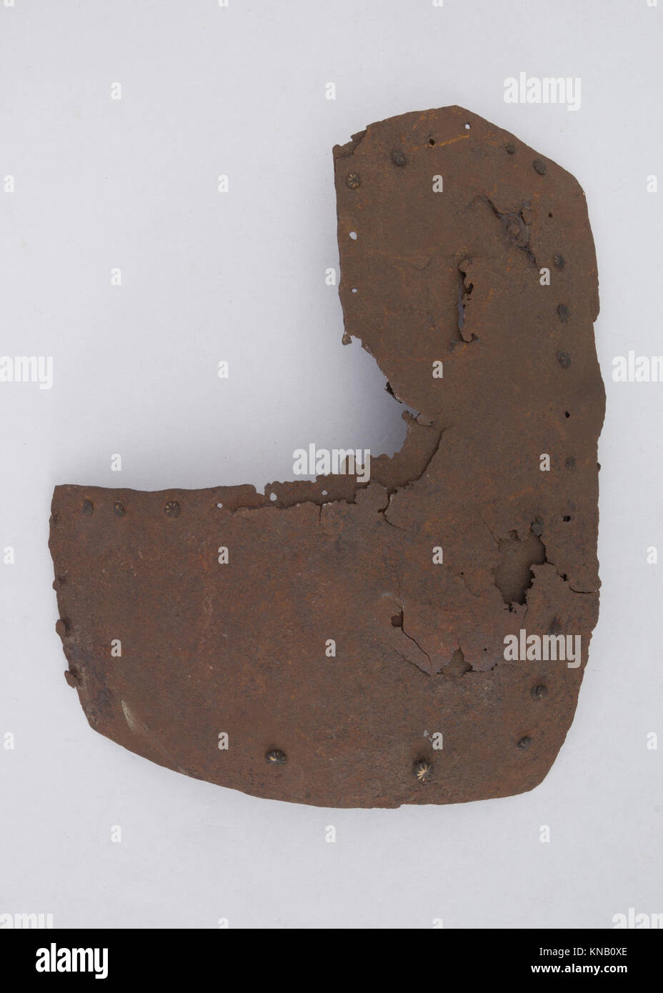 This brigandine plate, part of medieval armor, features a layered ...