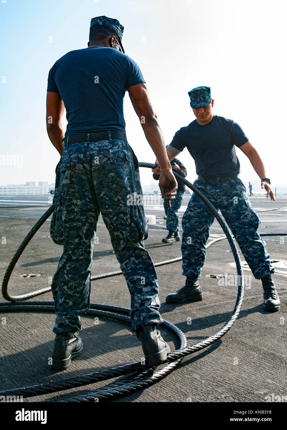 Aviation Boatswain's Mate (Equipment) 3rd Class Devin Rogers (Left) and Aviation Boatswain's