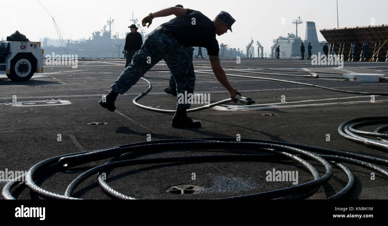 Aviation Boatswain's Mate (Equipment) Airman James Satila sets down