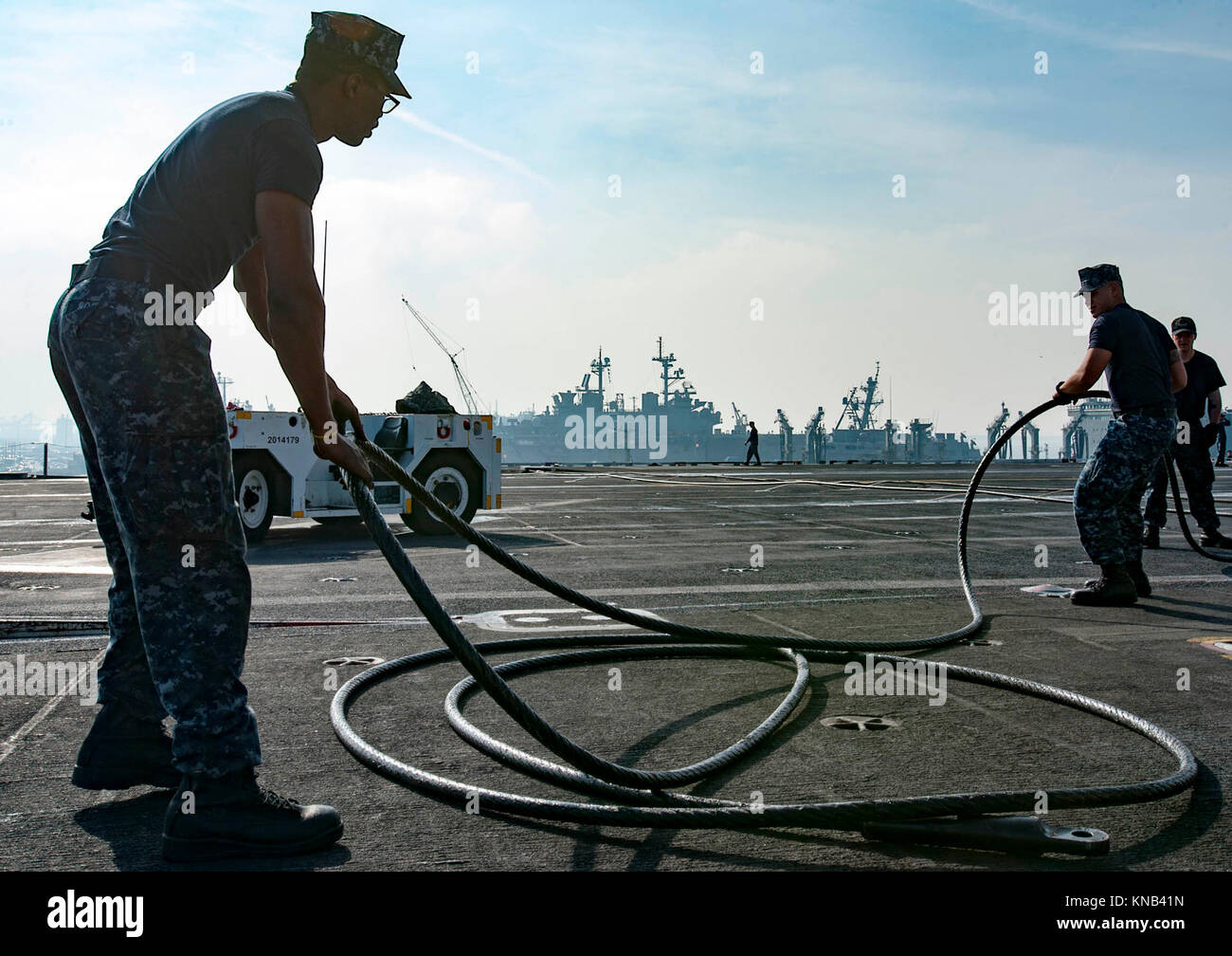 Aviation Boatswain's Mate (Equipment) 3rd Class Devin Rogers, left, and