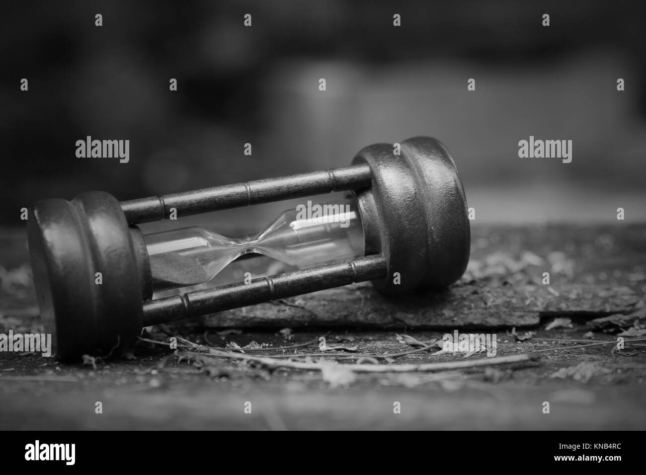 Sand clock on wood table Stock Photo Alamy