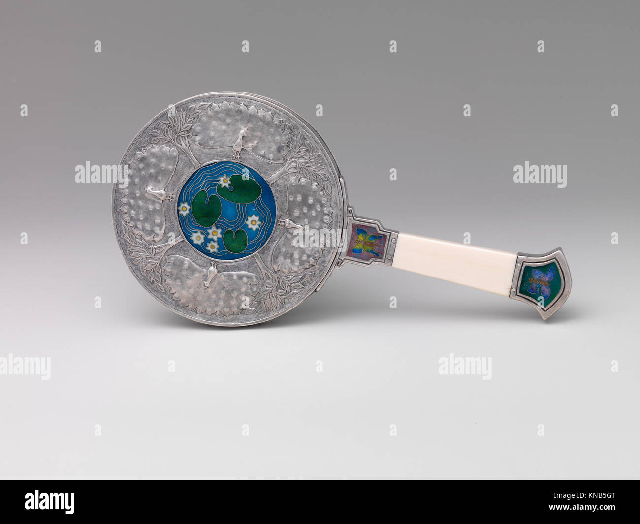 This hand mirror combines decorative design with practical function ...