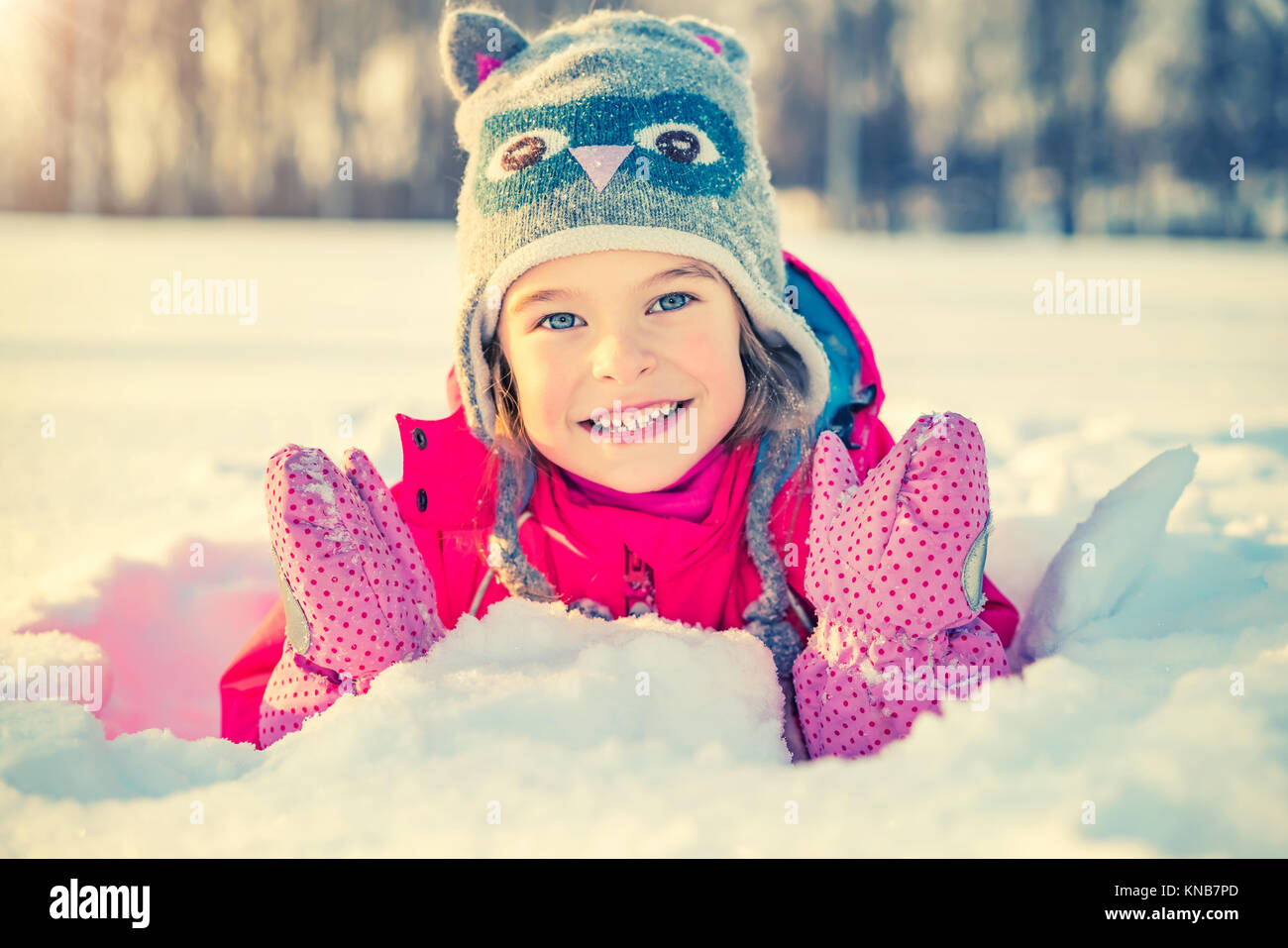 Little girl in a winter park Stock Photo