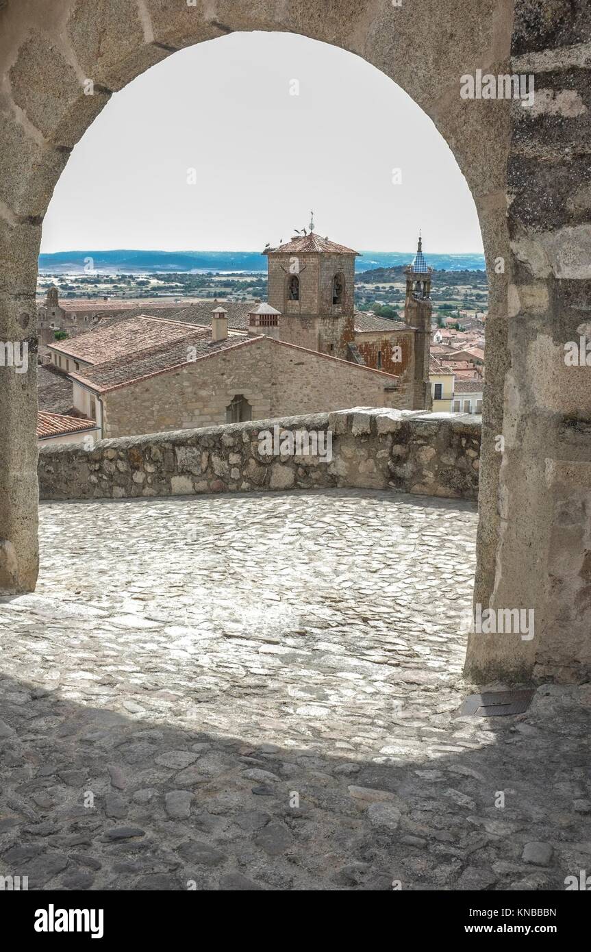 View from upper side to the centre of medieval Trujillo town under stone arch. Caceres, Extremadura Spain. Stock Photo
