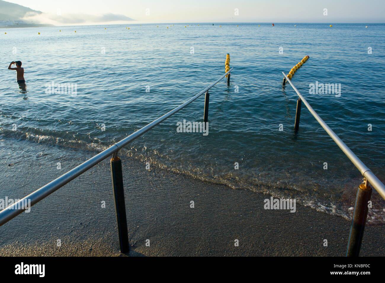 Handrails on beach for disabled people. Comfort place for handicap. Ceuta, Spain. Stock Photo