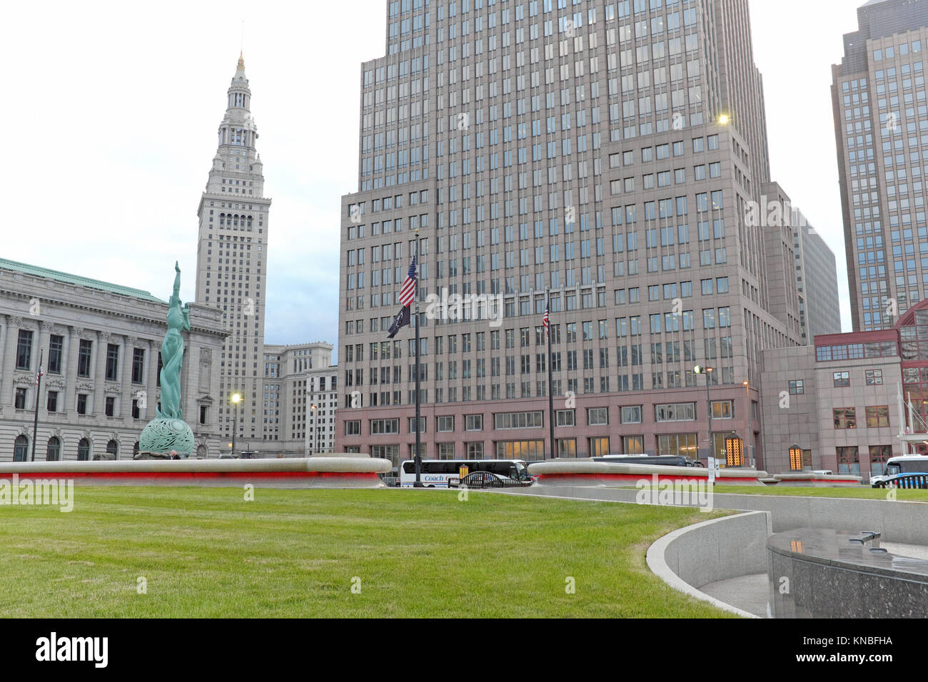 The outdoor grassy 'mall' area in downtown Cleveland, Ohio, flanked by iconic landmarks including the Fountain of Eternal Life statue on a fall day. Stock Photo