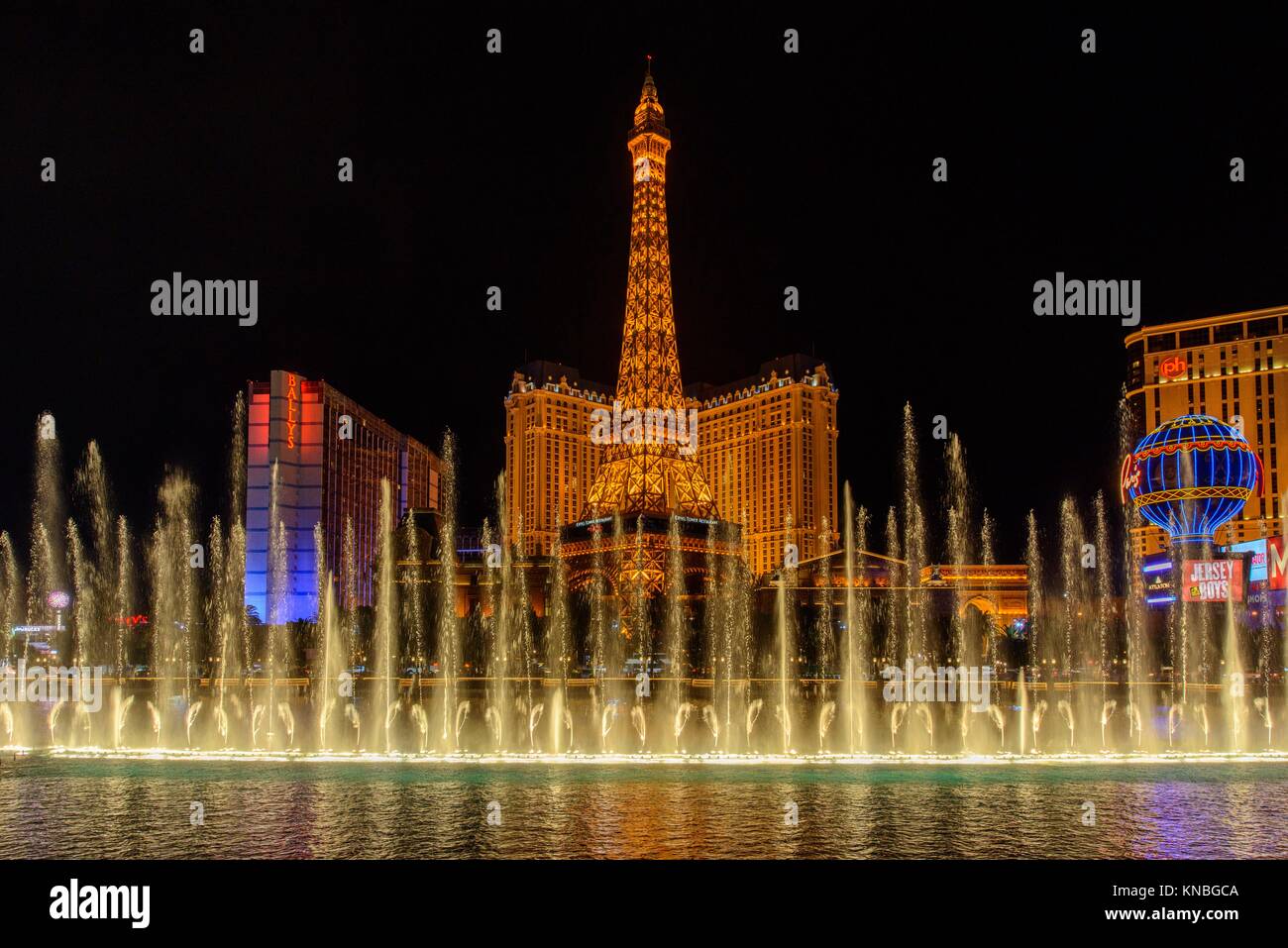 Fountains of Bellagio with Paris Hotel, Eiffel Tower replica, Las Vegas, Nevada, USA. Stock Photo