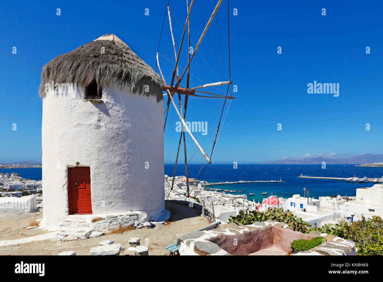 Great view at the port and Chora from a windmill of Mykonos, Greece Stock Photo
