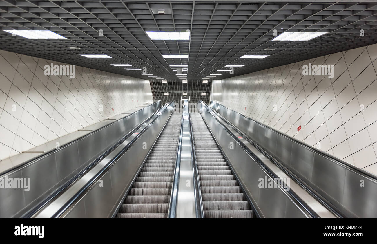 Moving stairs in underground.Escalator stairs in metro station Stock ...