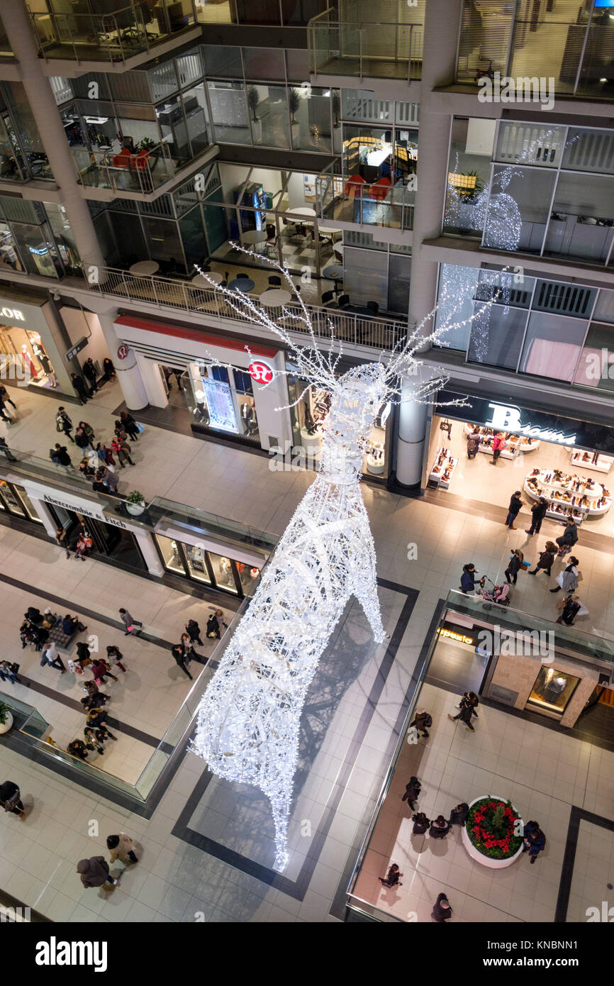 Toronto Eaton Centre Christmas decoration, an illuminated reindeer, inside the shopping mall, downtown Toronto, Canada. Stock Photo