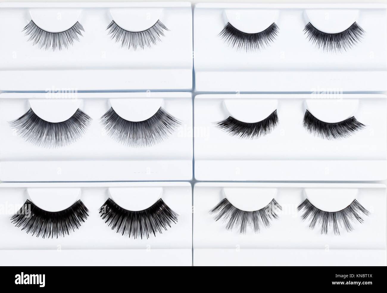 Set of Artificial Eyelashes in White Holder. Stock Photo