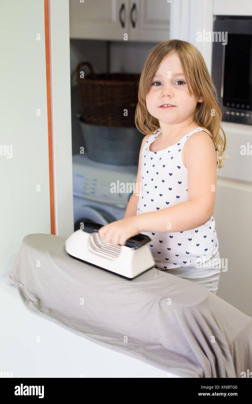 Ironing in the kitchen hires stock photography and images Alamy