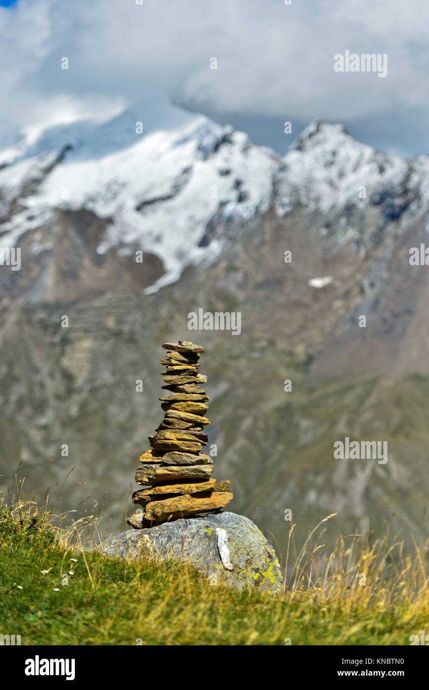 Cairn along the hiking trail to Hannigalp, Saas-Fee, Valais, Switzerland. Stock Photo