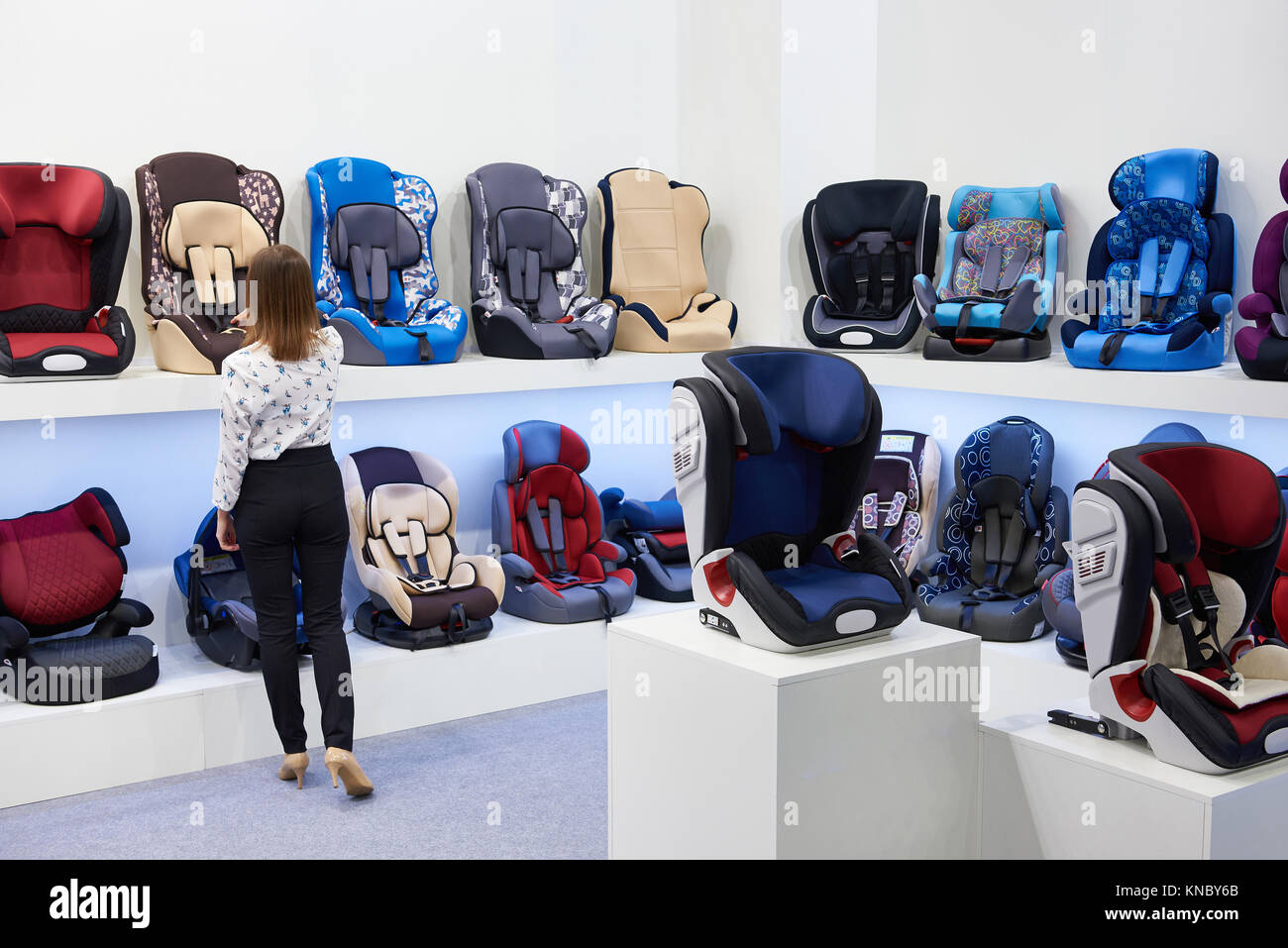 Buyer in the store of children's car seats Stock Photo