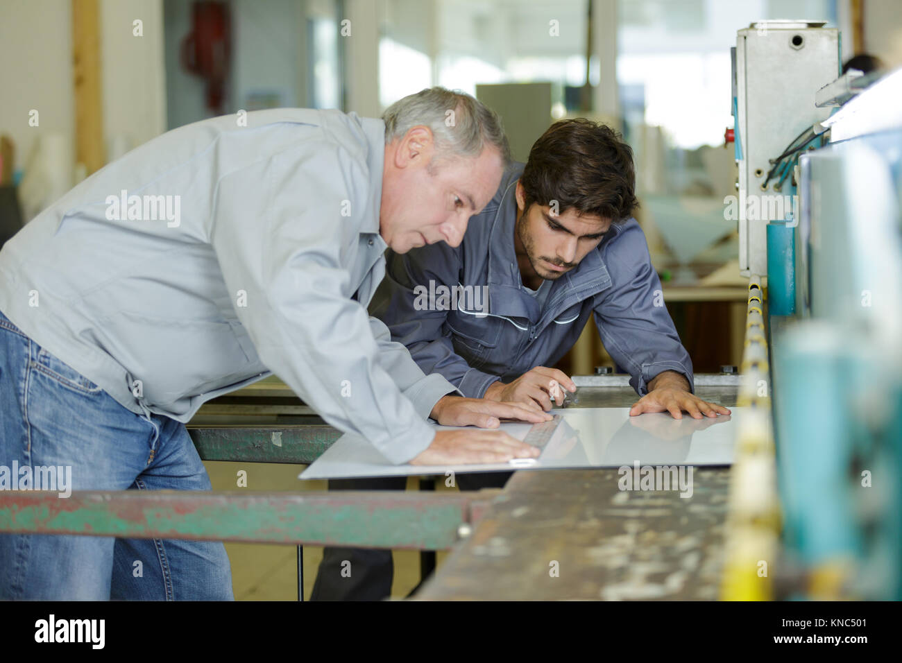 working engineers with factory plans Stock Photo - Alamy