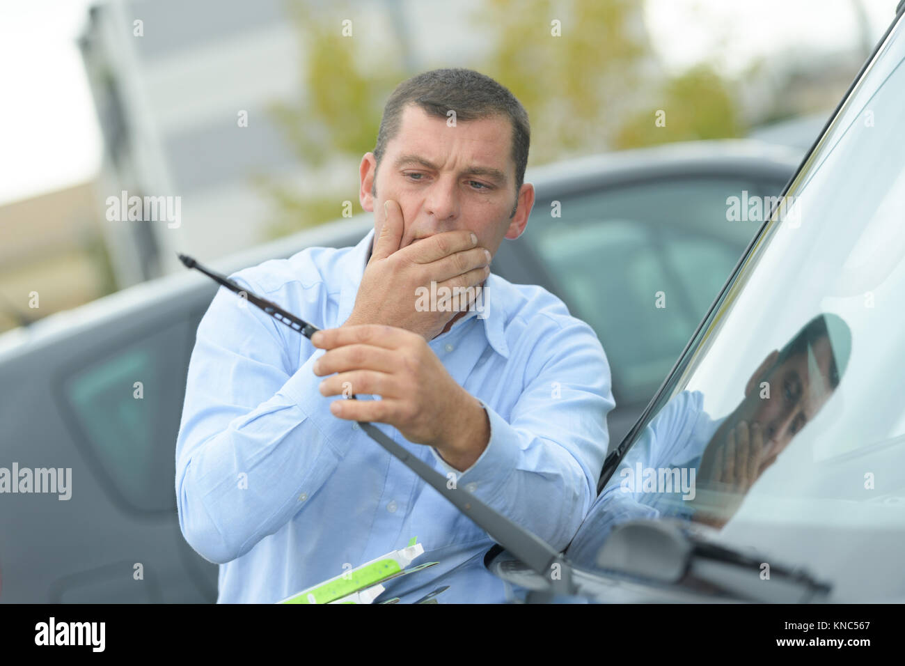 man found out his car wipers were broken Stock Photo Alamy