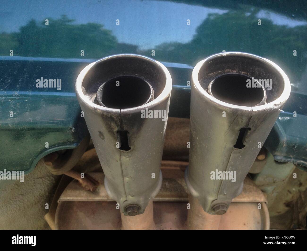 Double exhaust pipes from a car. Underside view. Stock Photo