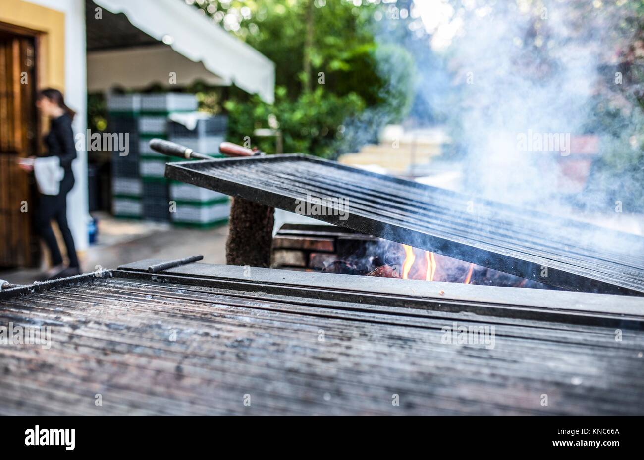 Grill heating up ready to start cooking. Outdoors restaurant. Stock Photo