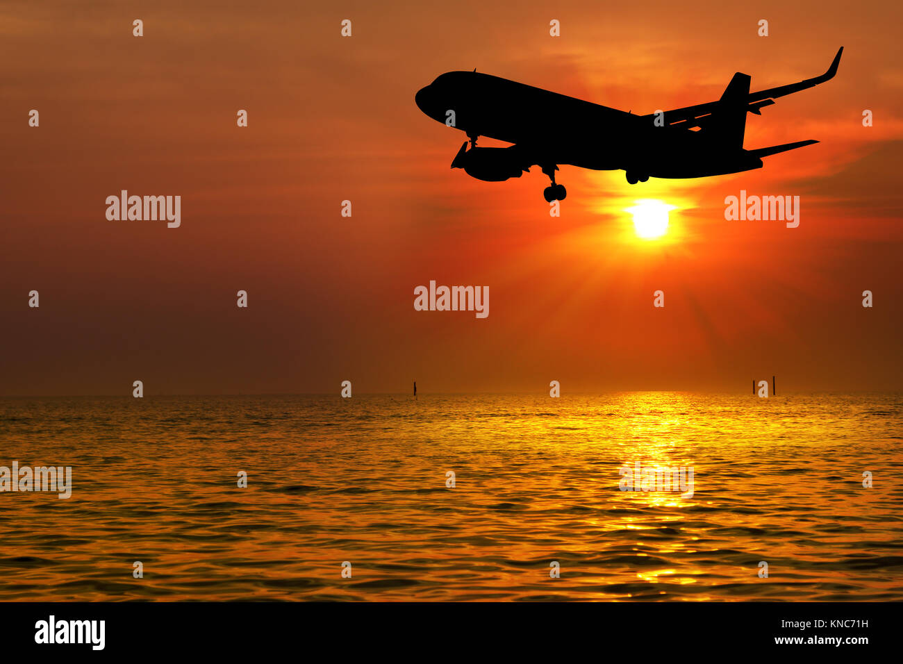 Silhouette of aircraft sunset Stock Photo - Alamy