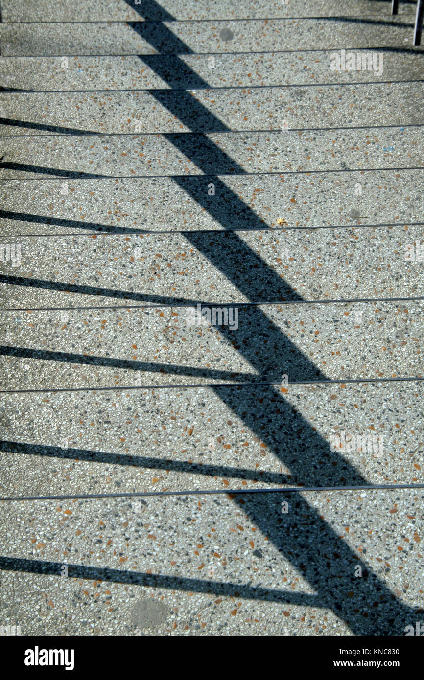 Zigzag pattern of shadow on bright, mosaic steps Stock Photo