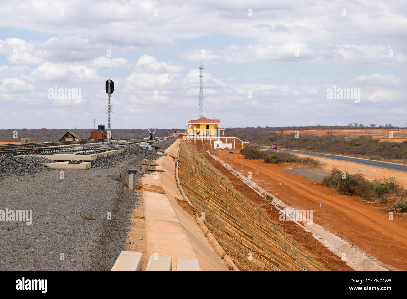 Part of the Mombasa to Nairobi Standard Guage Railway recently constructed in Tsavo, a small station house can be seen in the background, Kenya, East  Stock Photo