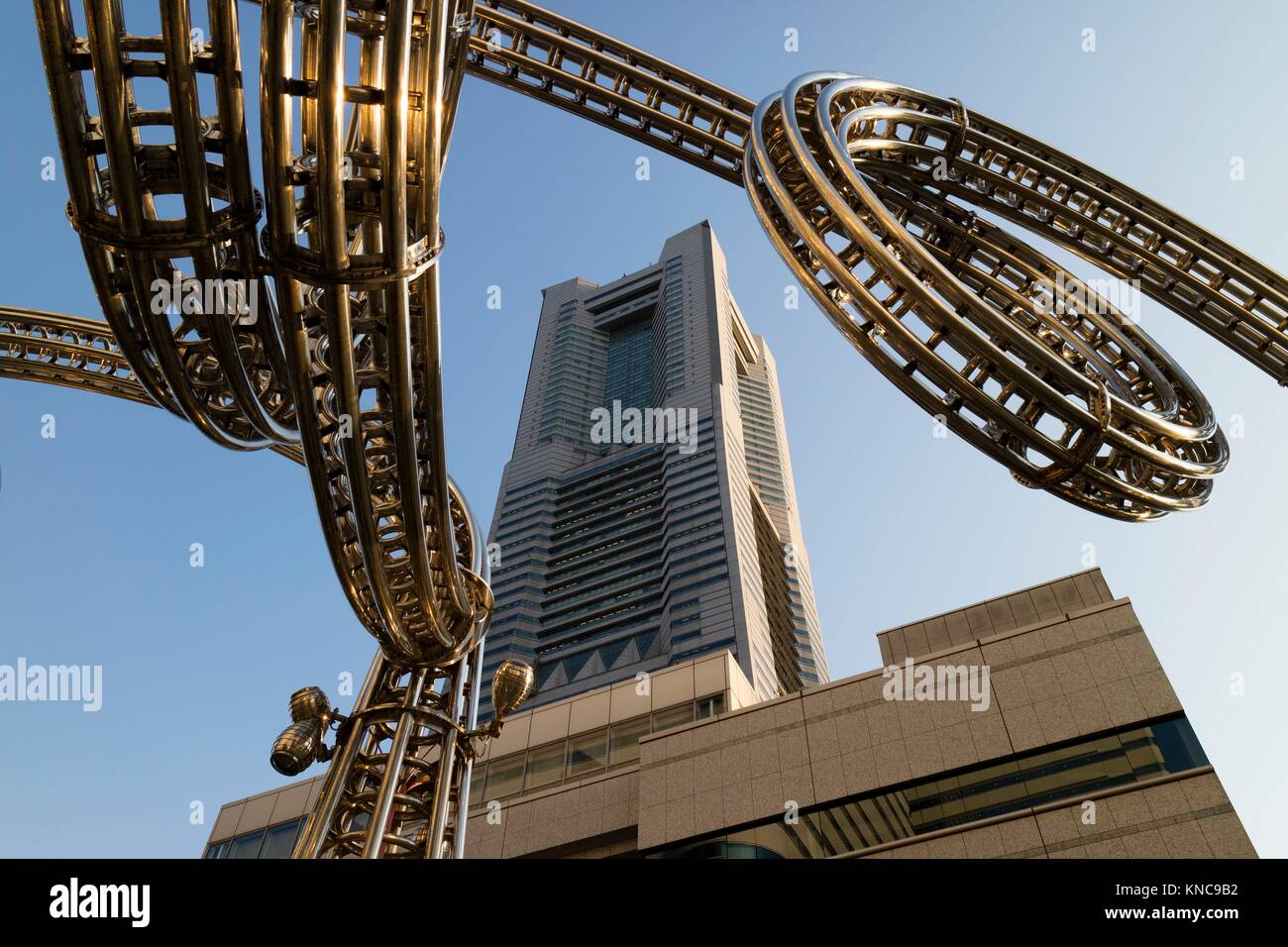 Yokohama, Japan - June 15, 2017: Futuristic stainless steel construction and the Landmark tower on Queen's Square shopping centre in Minato Mirai, Stock Photo