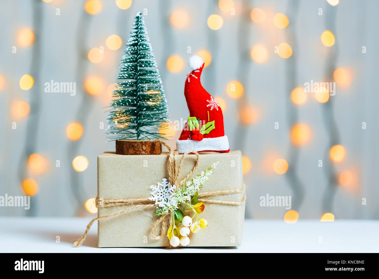 A Christmas Tree With Gift Box On Blurred Bokeh Banner Background