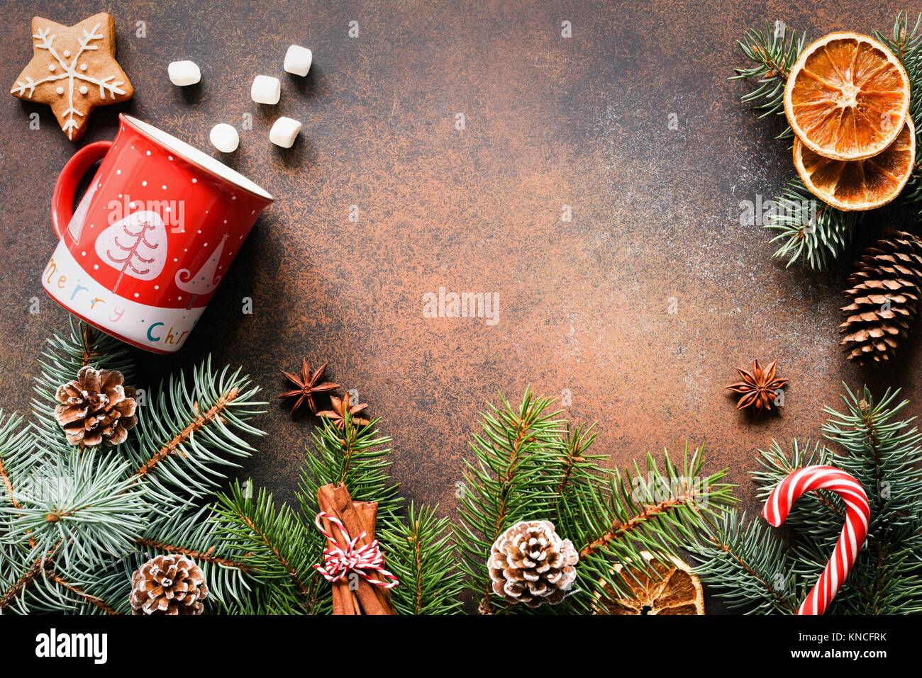 Christmas or New Year frame with fir tree, candy cane, hot chocolate, spices and cookies. Copy space for text. Design mock up for Christmas cards, gre Stock Photo