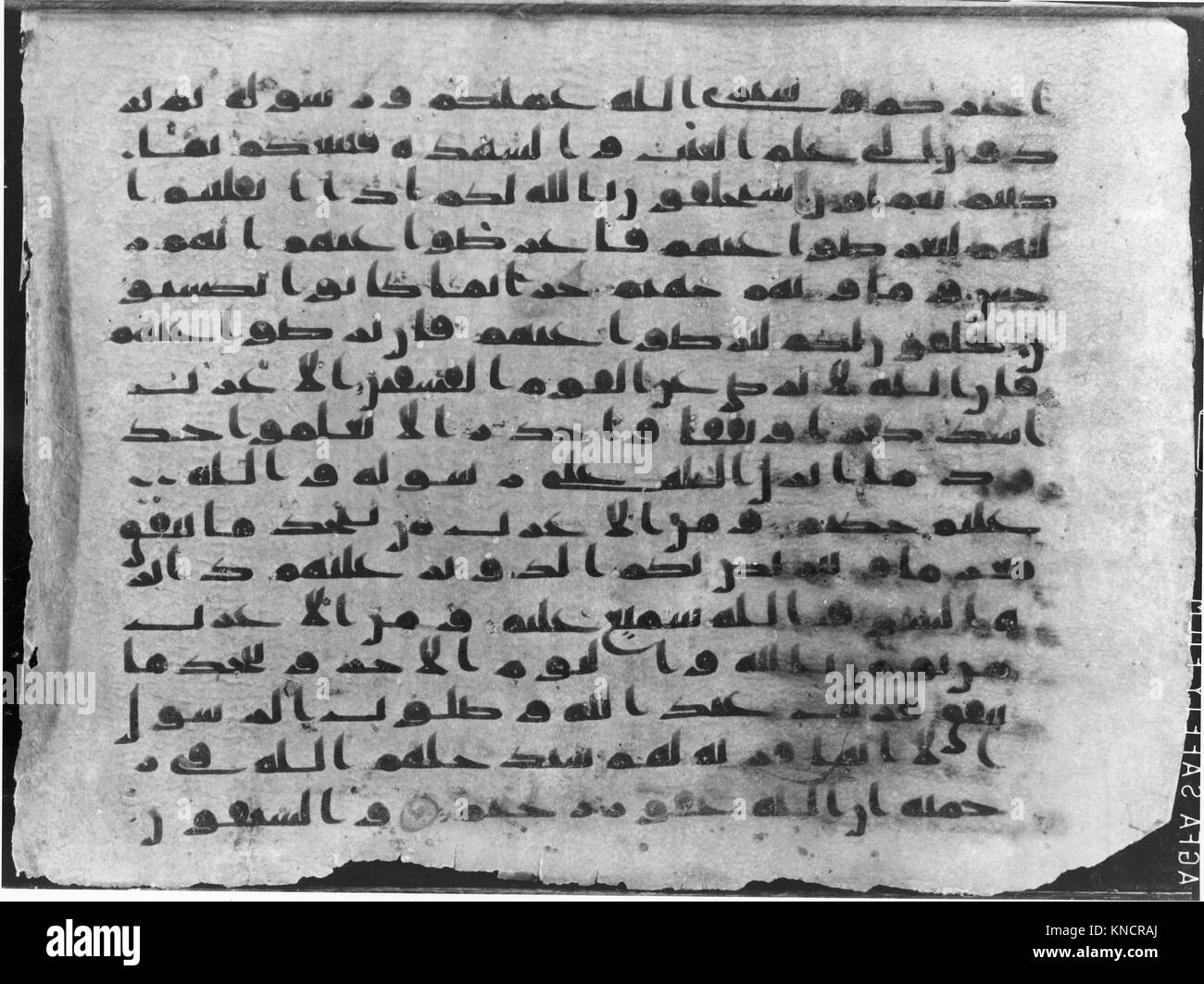 This Qur'an manuscript folio features Arabic calligraphy and ornamental ...