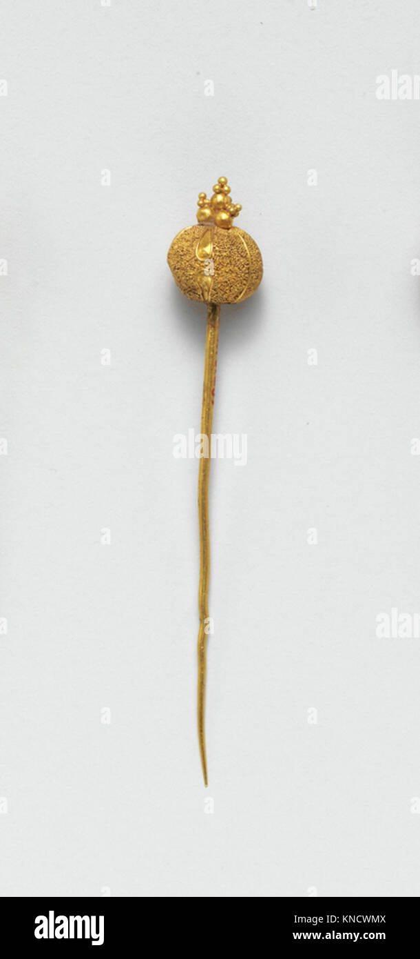 This gold pin is a fine example of jewelry craftsmanship, reflecting ...