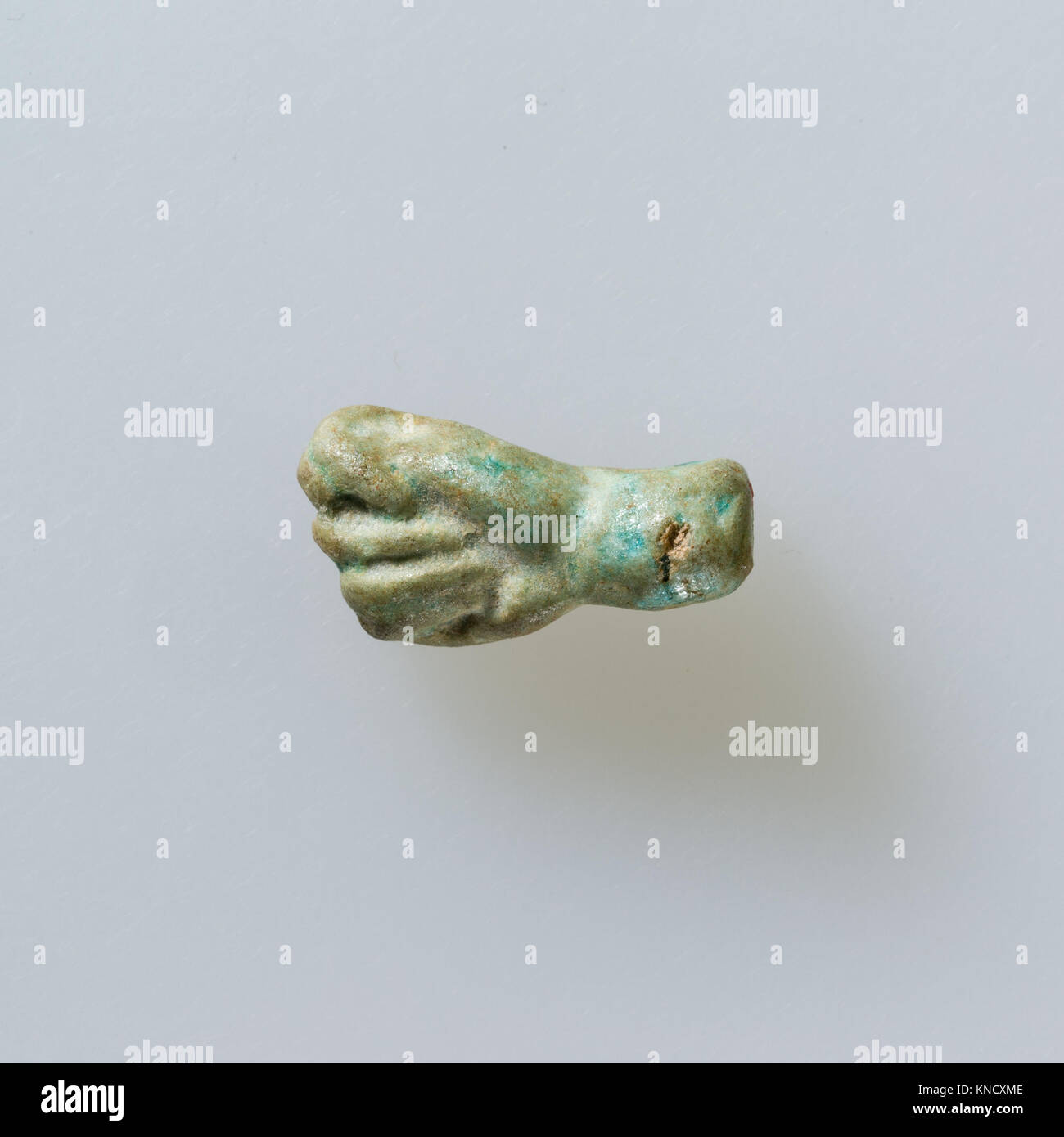 Amulet of fist with thumb thrust between first two fingers MET LC15 43 41 EGDP023560 555337